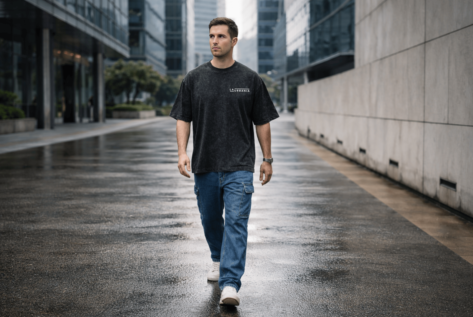 LaUrbania Jet Black stone washed oversized t-shirt model walking quiet wet street glass building
